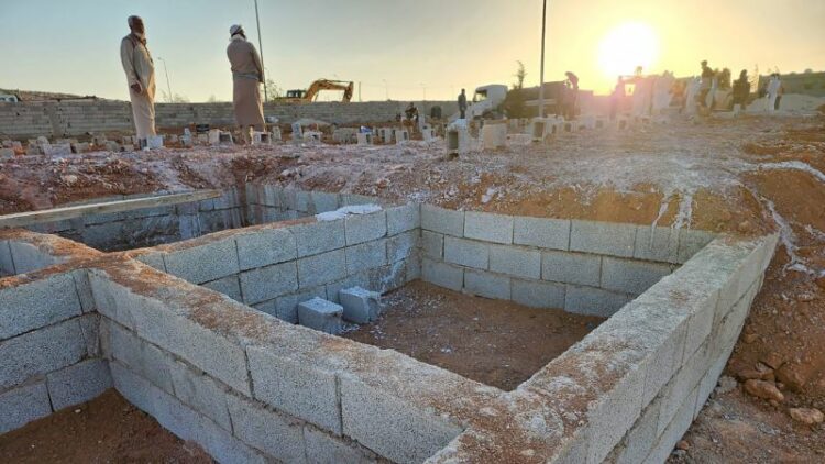 ‘This is God’s will.’ Survivors dig mass graves for those killed in Libya’s devastating floods