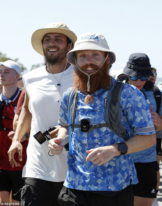 Cook, 27, (pictured) celebrated as he completed his 10,100 miles from Cape Agulhas in South Africa to Ras Angela, Tunisia, in 352 days