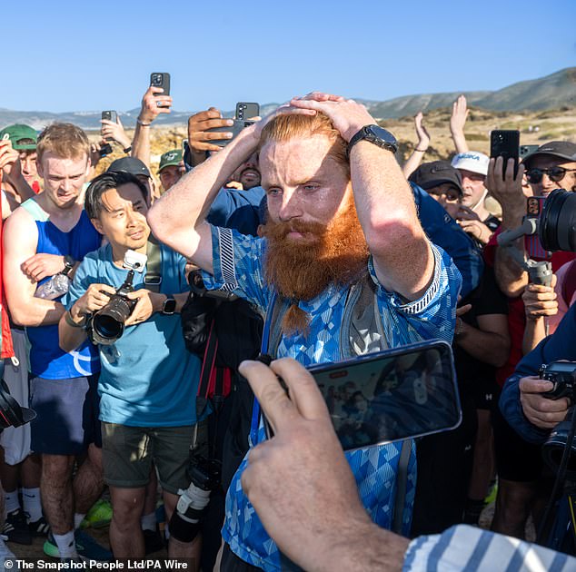 British runner Russ Cook is joined by supporters on the final leg of his challenge