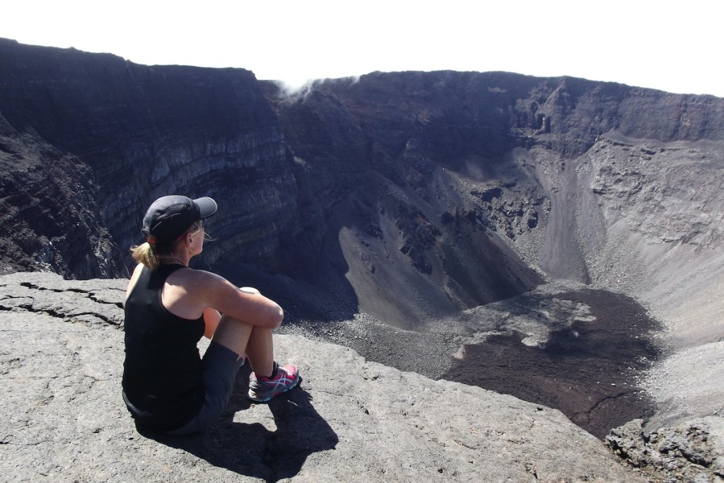 Woman looking into a caldera. 