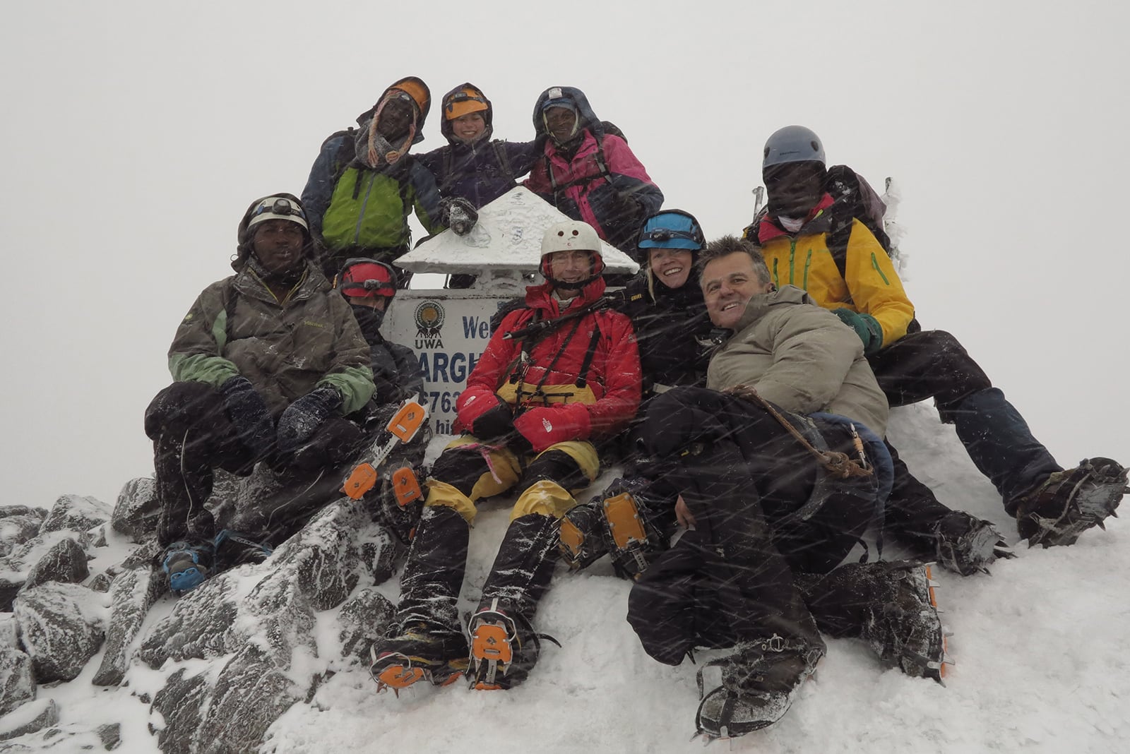 The trekking team at the Rwenzori Mountain summit just before a blizzard.