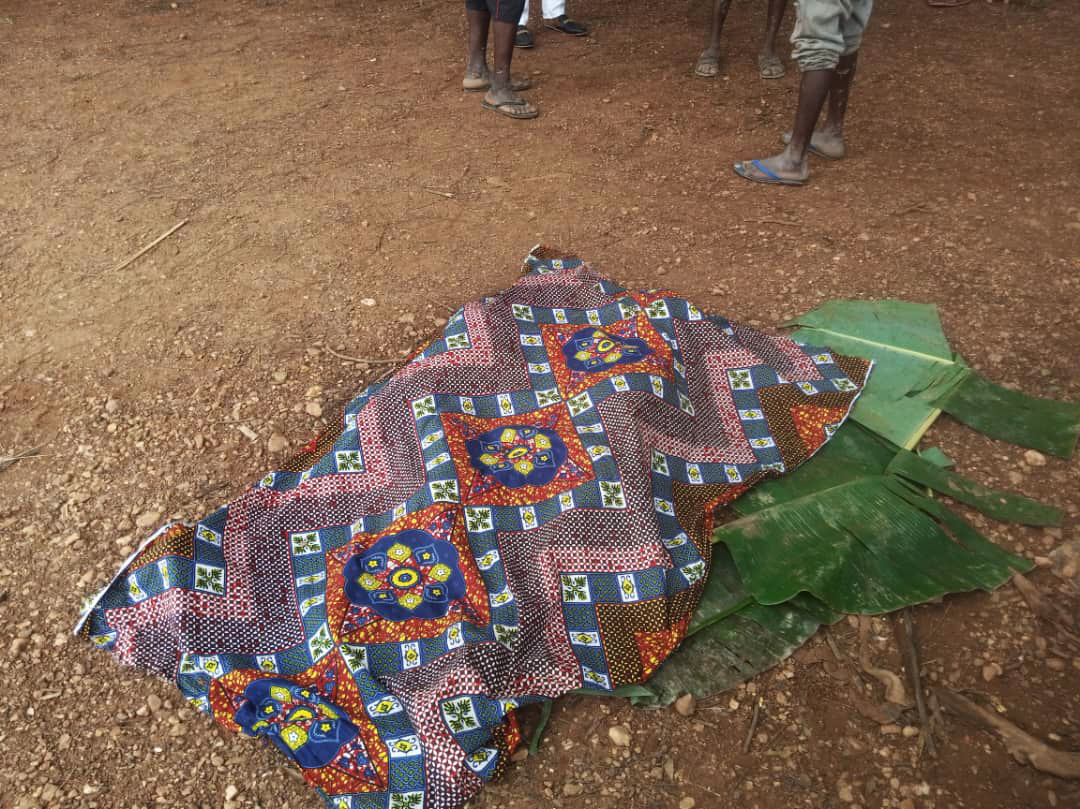 The covered body of one of the three drowned boys.