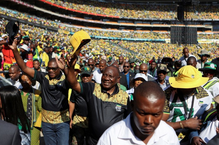 Cyril Ramaphosa greets supporters on his arrival at the political party’s final rally ahead of the election at FNB stadium in Johannesburg in May