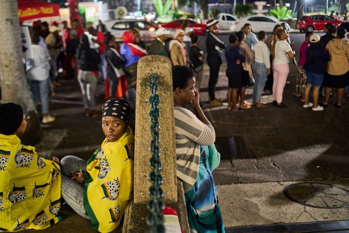 Voters line up outside the city hall voting station in Durban in May