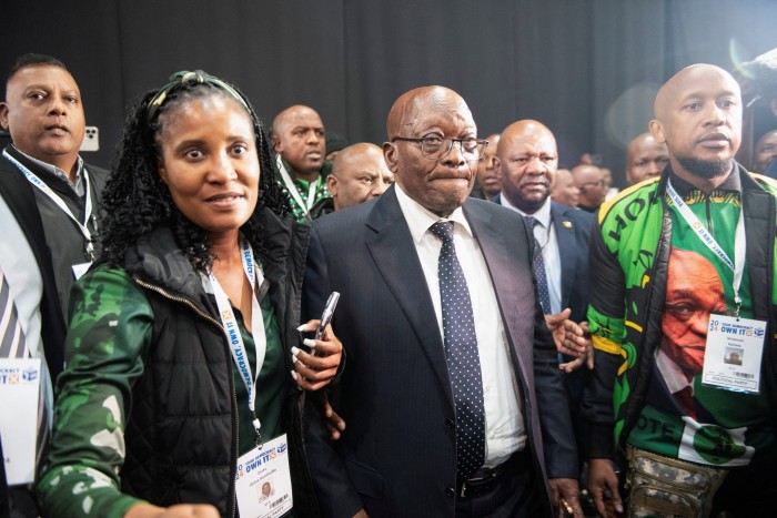 Jacob Zuma, former president, arrives with his daughter and member of uMkhonto weSizwe Duduzile Zuma at the National Results Operation Centre of the IEC, where election results are displayed