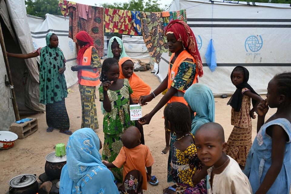 A UNICEF-supported peer educator sensitizes children about HIV in Maroua, Cameroon, where resources are scarce, violence is common, and disease is rife. 