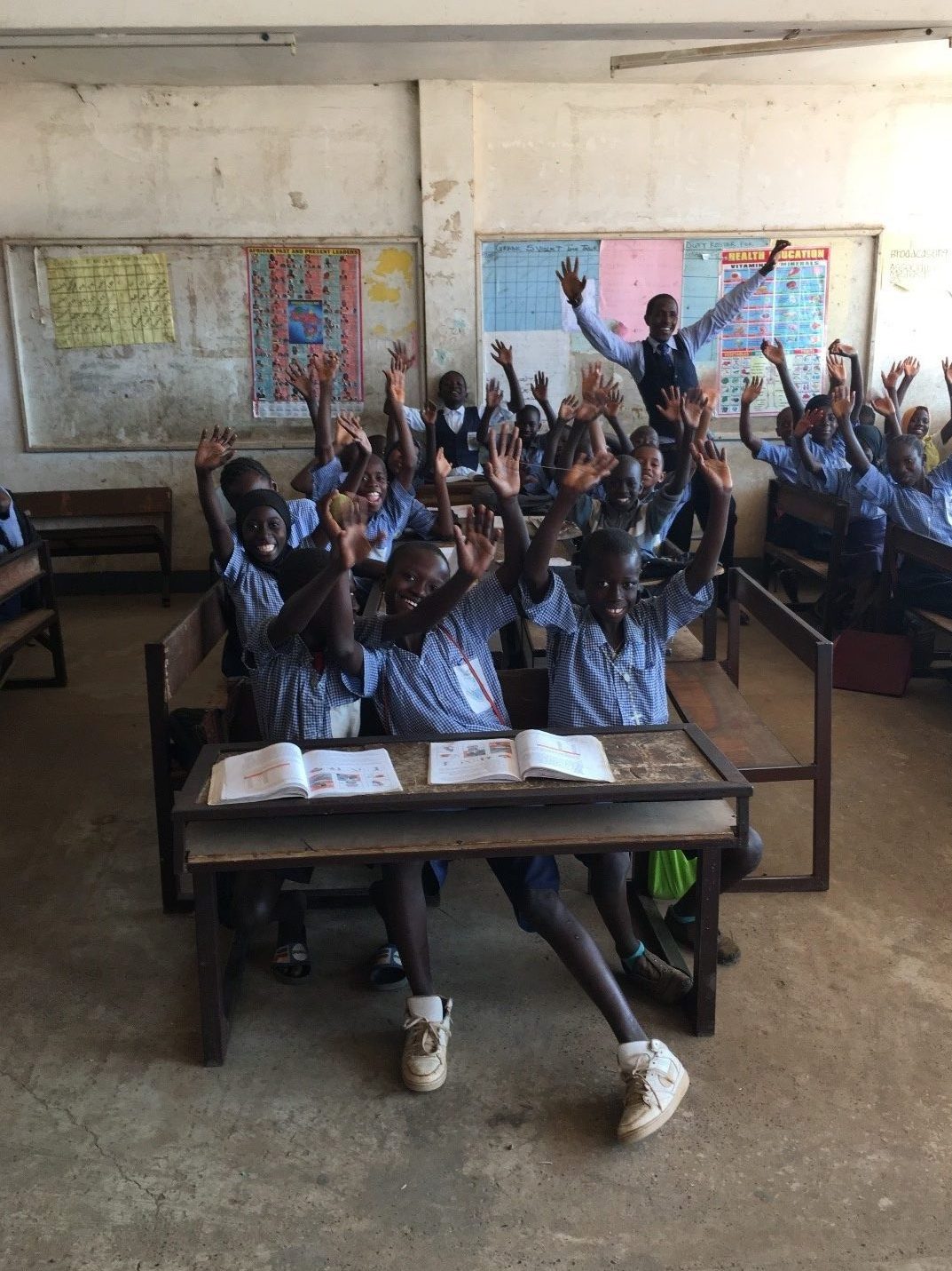 Teacher and students at Abuko Lower Basic School