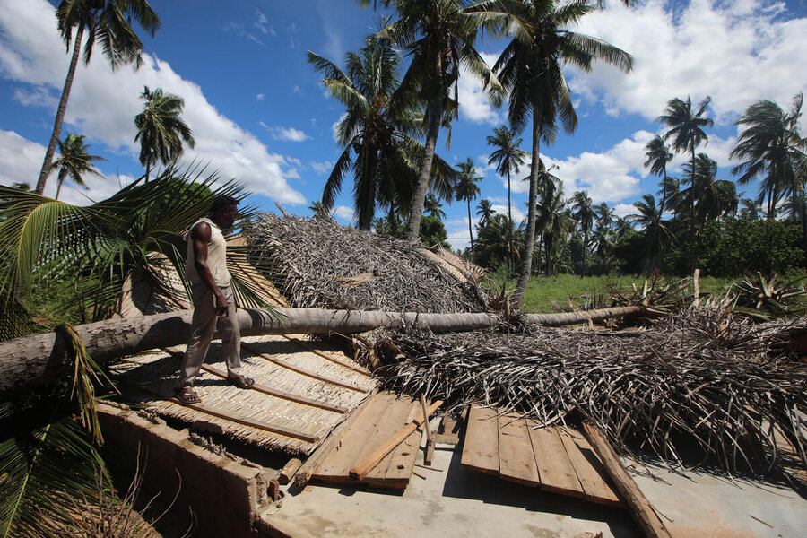 A man assesses a house flattened in Morrumbene, Inhambane province