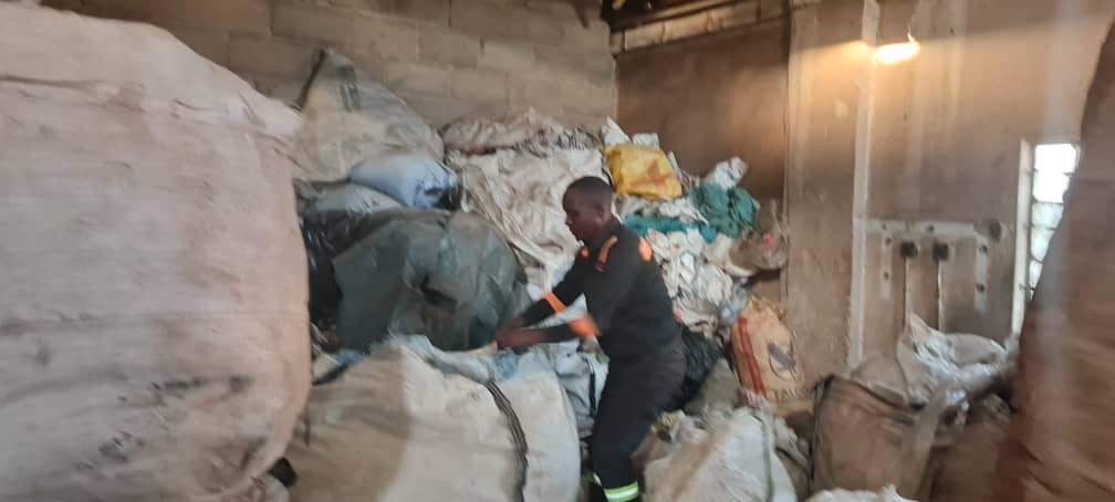 A worker at Stable Packaging sorts plastic waste ready for recycling.