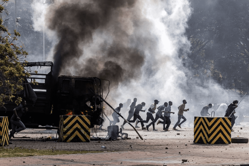 Kenya’s president calls protests ‘treasonous’ after police fire live rounds at demonstrators