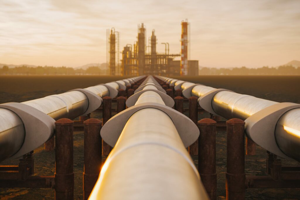 Oil Refinery And Pipeline In Desert During Sunset