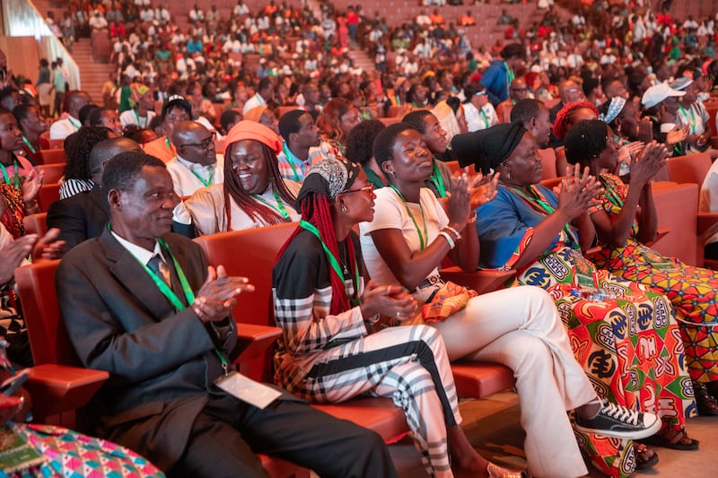 Audience members clap during the 2024 Strengthening Families Conference in Abidjan, Ivory Coast.