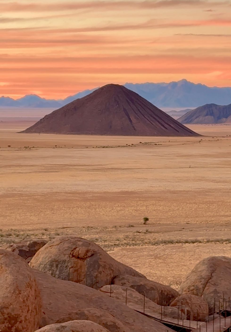 a desert landscape with a bridge