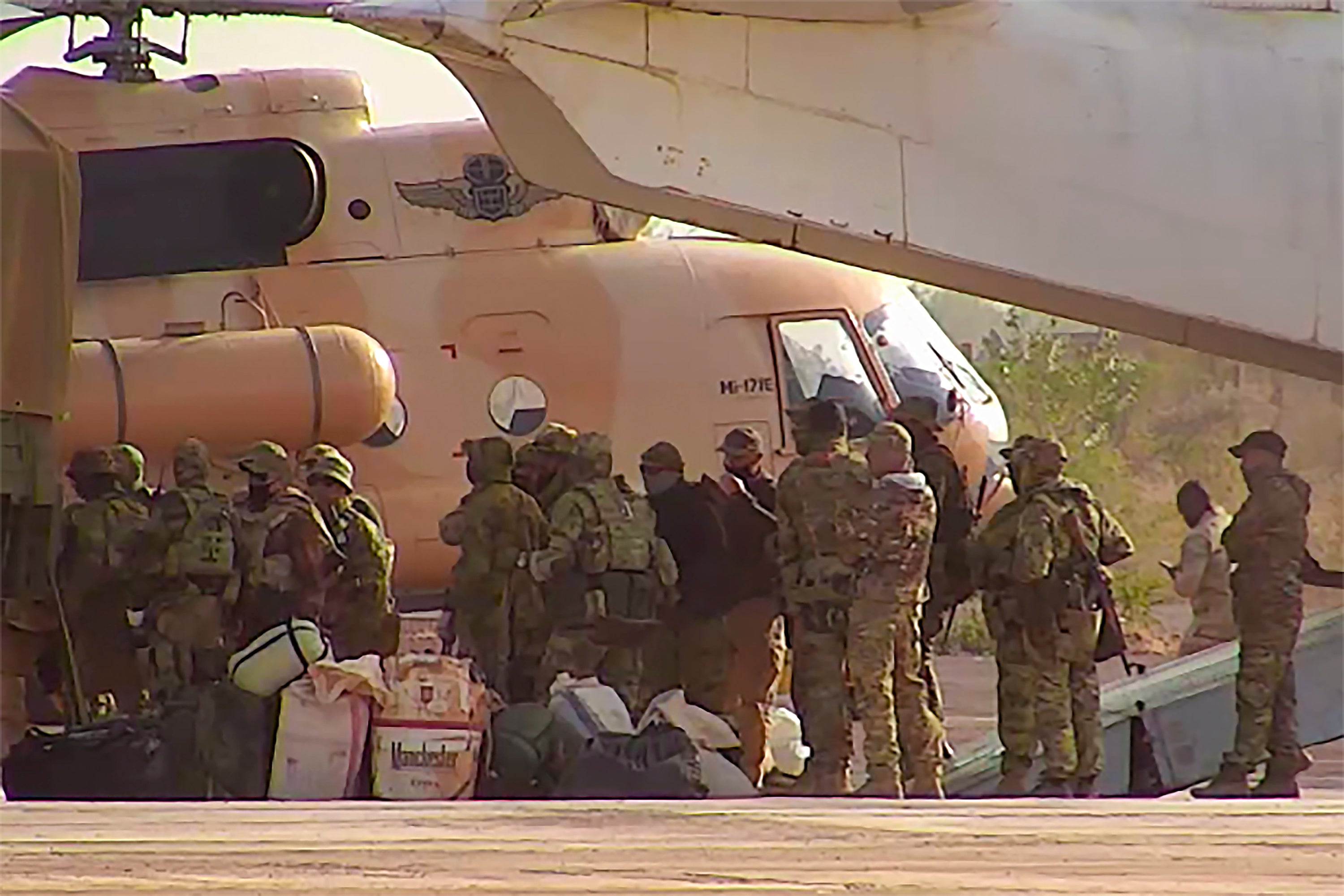 This undated photograph handed out by French military shows Russian mercenaries boarding a helicopter in northern Mali. Russia's foreign minister Sergey Lavrov went on a tour of the Sub-Saharan region of the Sahel