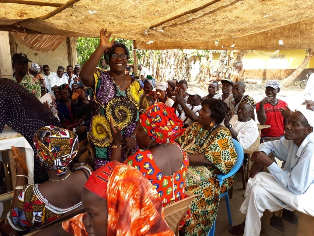 Sierra Leone Unity Party leader Femi Claudius-Cole chats with women at Congo Town market in Freetown