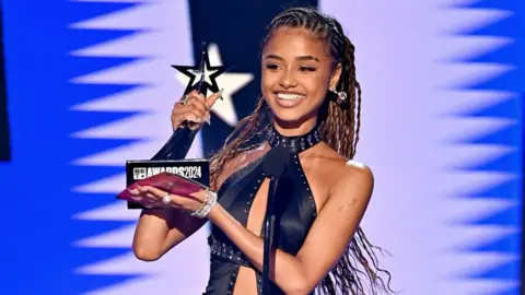 Getty Images Tyla  accepts the award for Best International Act during the 2024 BET Awards on 30 June 2024
