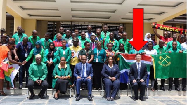 Professors at the Nyerere school with students. Follow the red arrow… Source: Government of Tanzania.