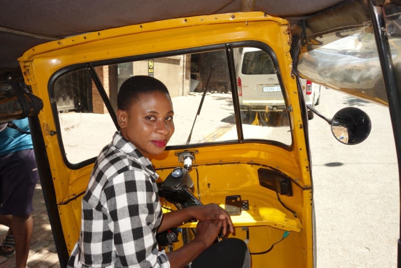 Sharon Miricale from Uganda works as a tuk tuk driver in Johannesburg. Andreas Drouve/dpa