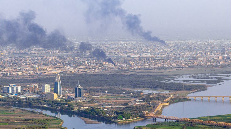 Smoke rises after military clashes in Sudan.