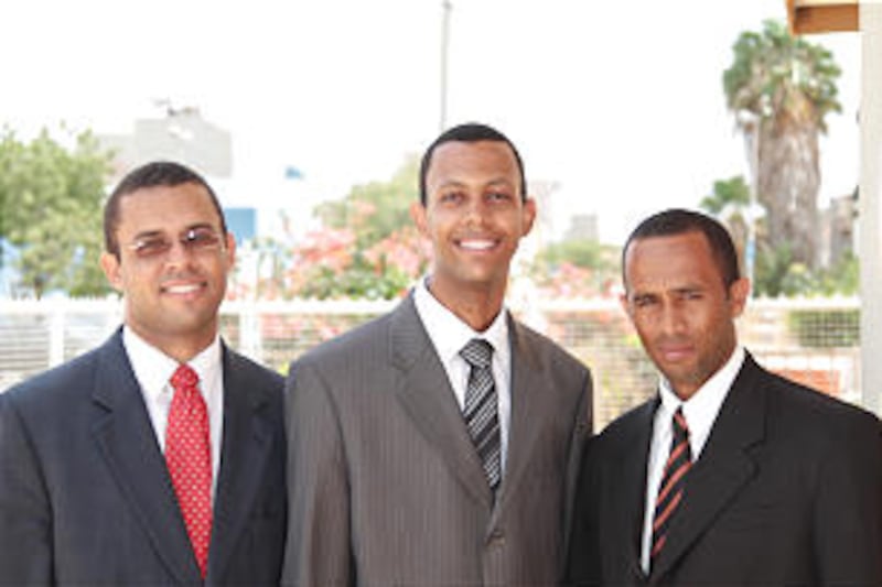 New Cape Verde Stake President Roseveltt Teixeira, center, is joined by his counselors, Adilson Mont