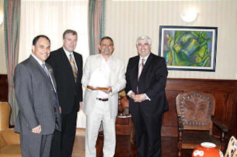 President of the Republic of Cape Verde, Jose Carlos Fonseca, second from right, is presented a stat