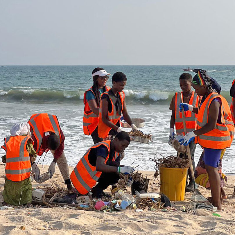 Beach cleaning activity with Doyinsola Ogunye.