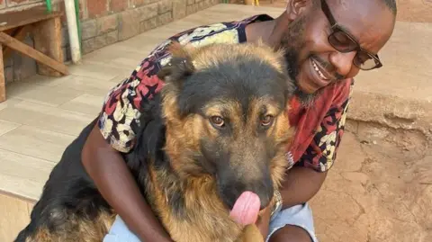 BBC / Kennedy Gondwe Kennedy with his dog