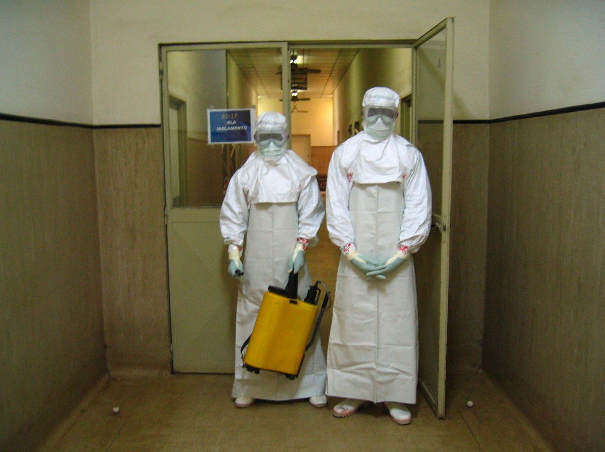 Health workers in protective gear in Angola