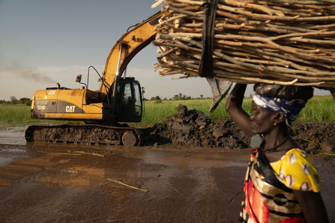 A UN mission repairs a damaged dike.