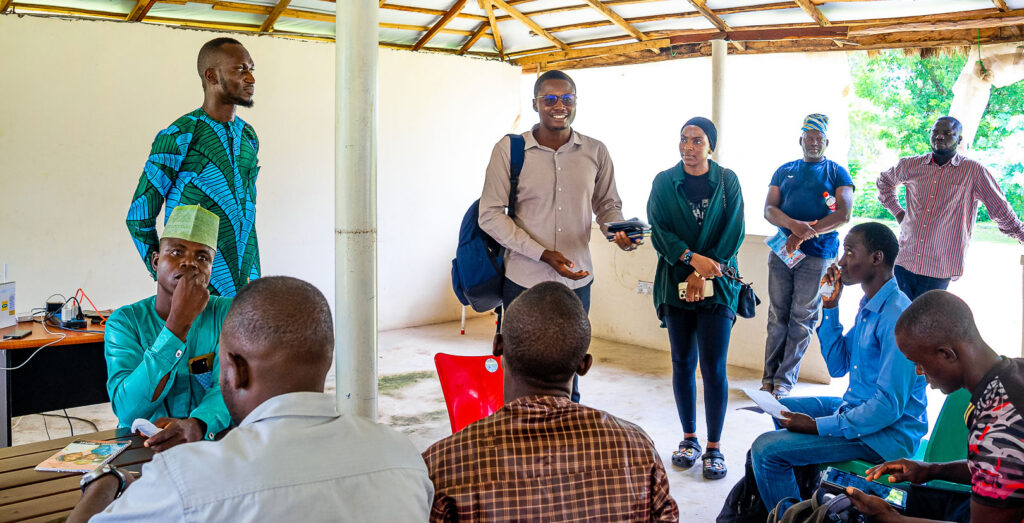 Ayodeji Ojo discussing with Field Officers of One Acre Fund, Minna, Niger State