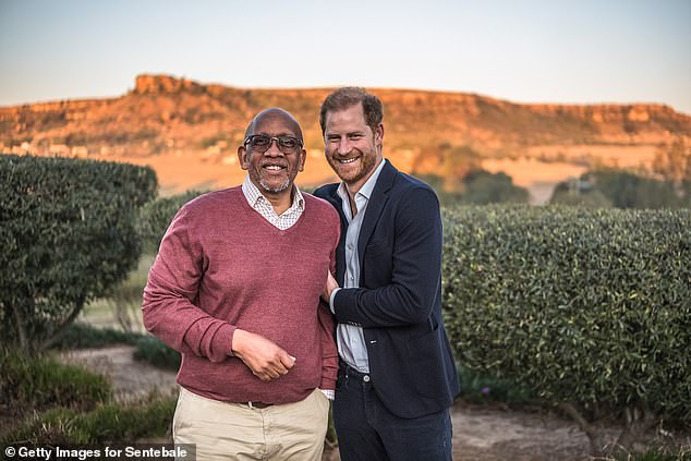 Prince Harry smiles with Prince Seeiso of Lesotho at an event in Maseru, Lesotho, yesterday